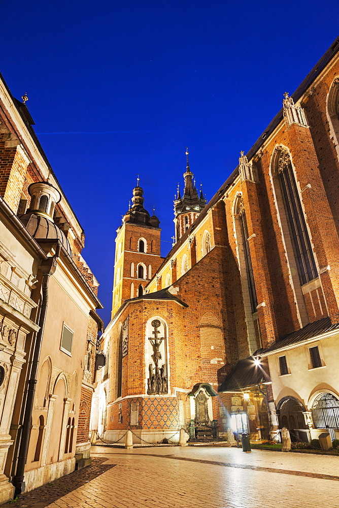 Street-level view of illuminated St. Barbara Church, Poland