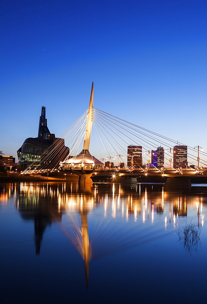 Canadian Museum for Human Rights and Esplanade Riel bridge at dusk, Winnipeg Manitoba, Canada