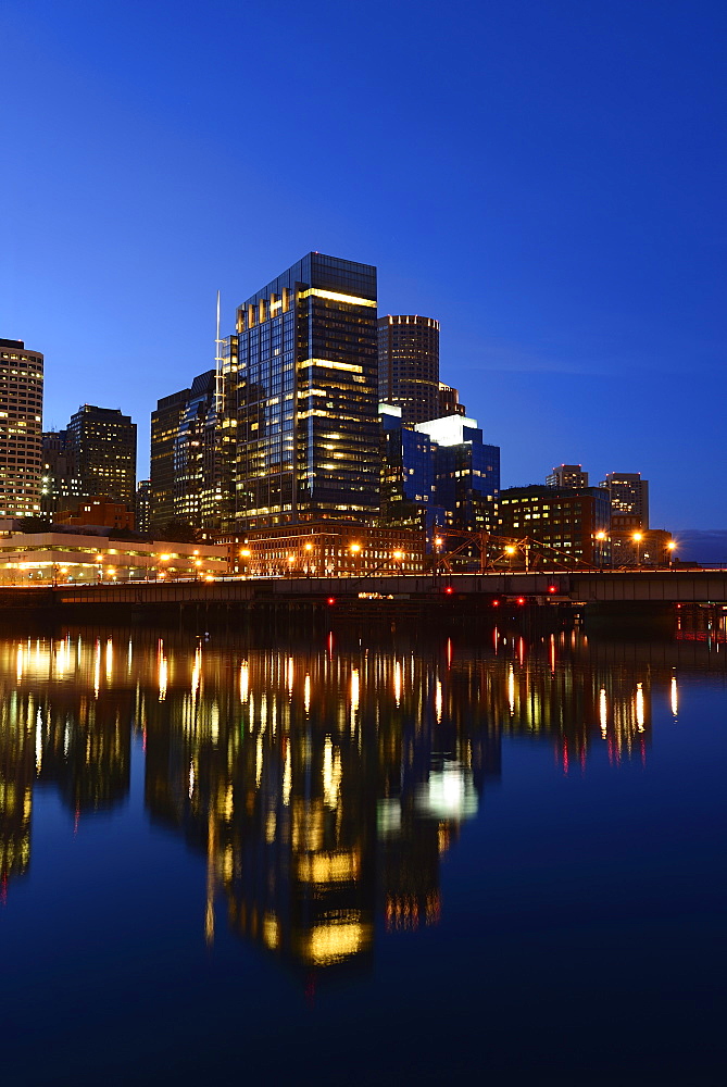 Waterfront reflecting in Channel at dusk, Boston, Massachusetts