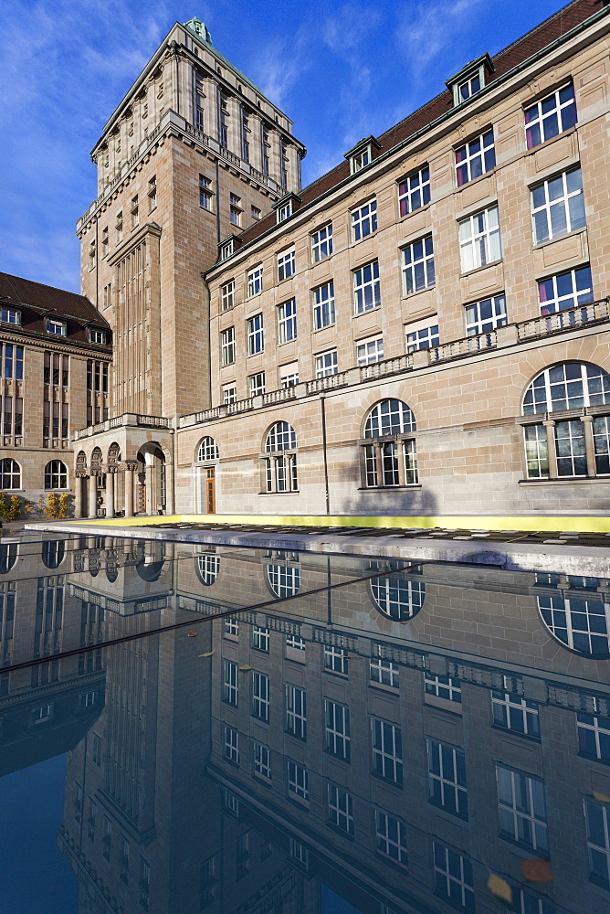 University of Zurich building reflecting in pond, University of Zurich, Zurich, Switzerland