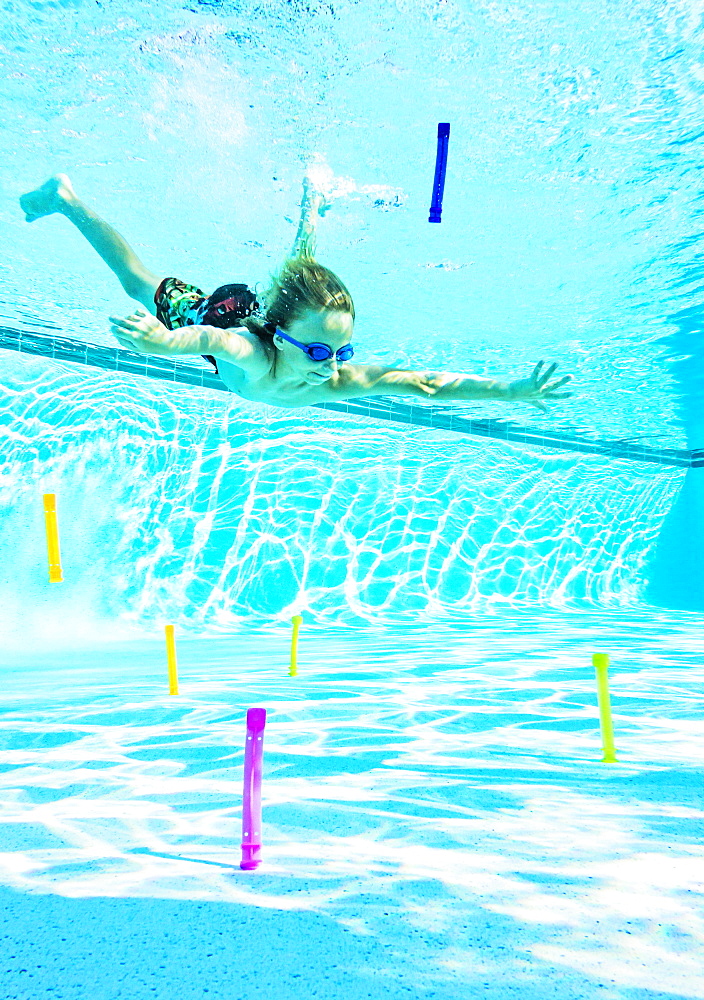 Boy (8-9) swimming in pool, Florida,USA