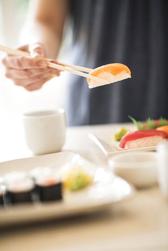 Close-up of woman preparing sushi