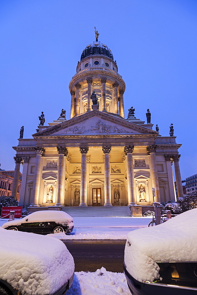 Illuminated French Cathedral in winter, Germany, Berlin, Gendarmenmarkt, French and German Domes