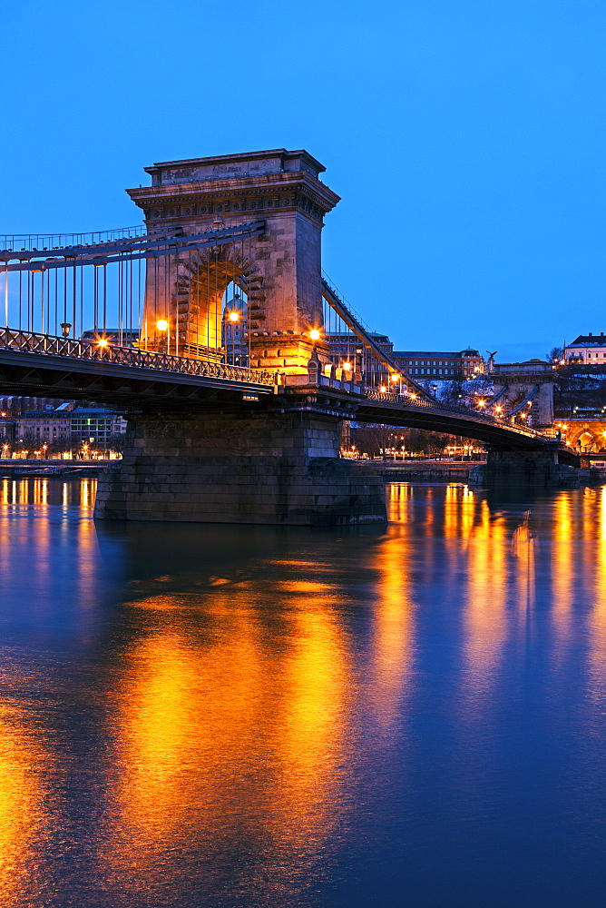 Illuminated Chain Bridge and reflections on water, Hungary, Budapest, Chain bridge