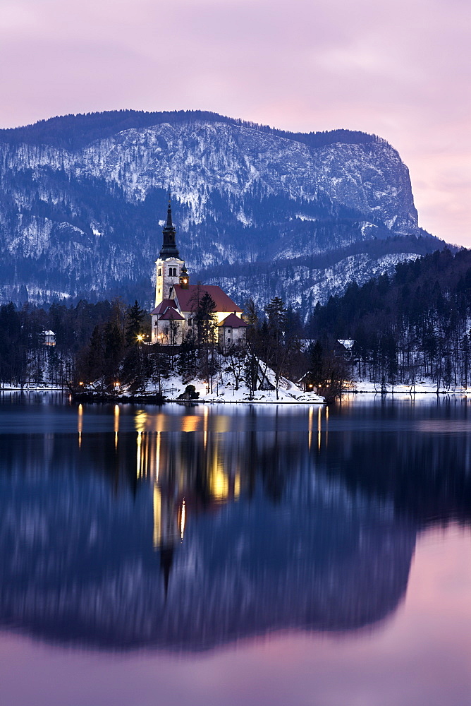 Lake Bled and illuminated Church of the Assumption, Slovenia, Bled