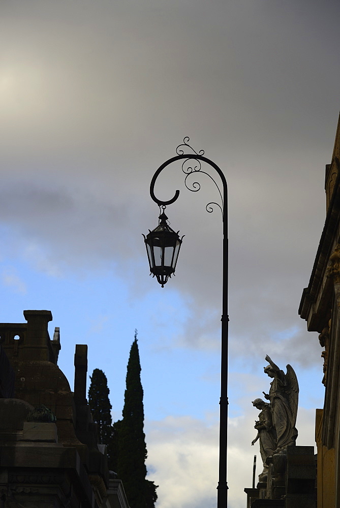 Argentina, Buenos Aires, Recoleta Cemetery, Sculpture and antique street light, Argentina, Buenos Aires, Recoleta Cemetery