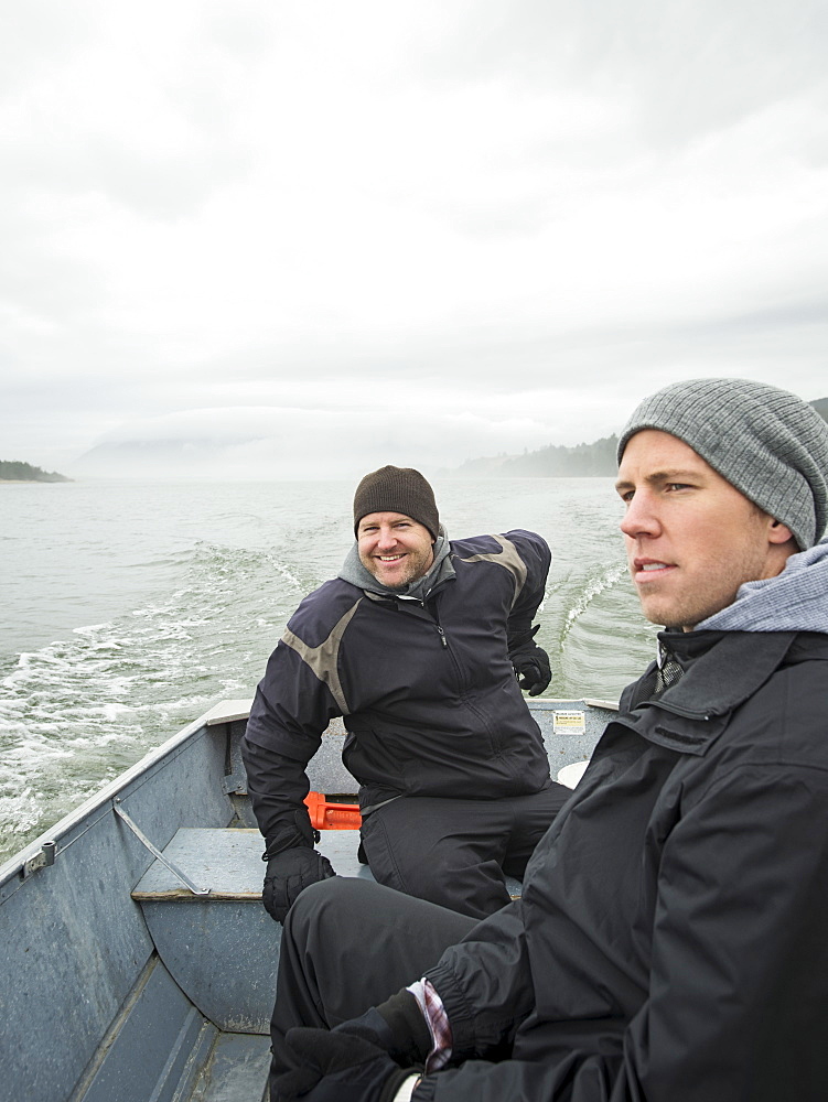 Portrait of men in boat, Rockaway Beach, Oregon