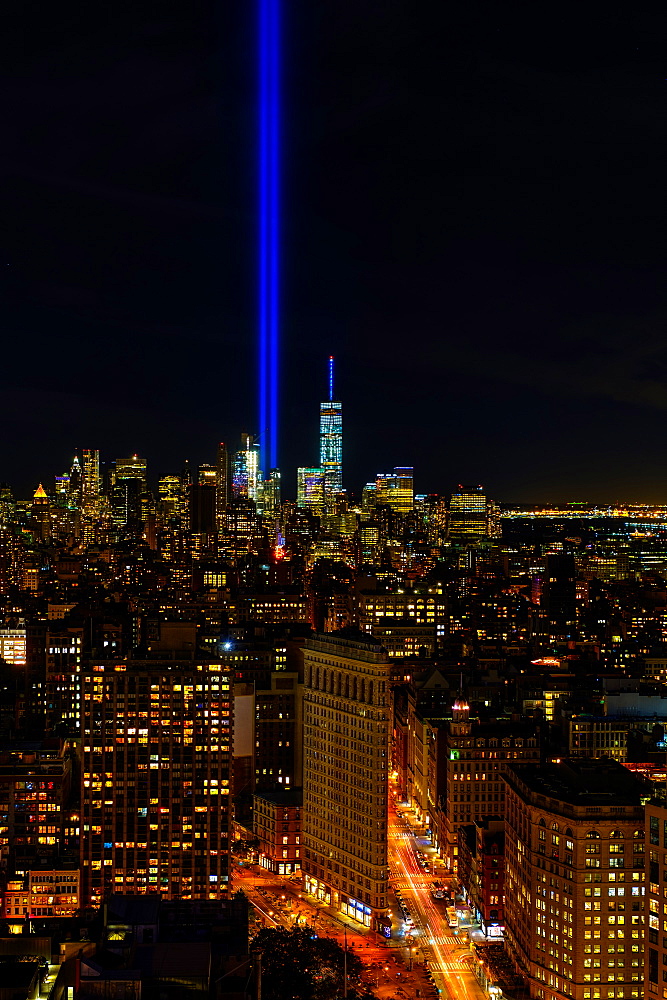 USA, New York State, New York City, Cityscape with light beam over ground zero