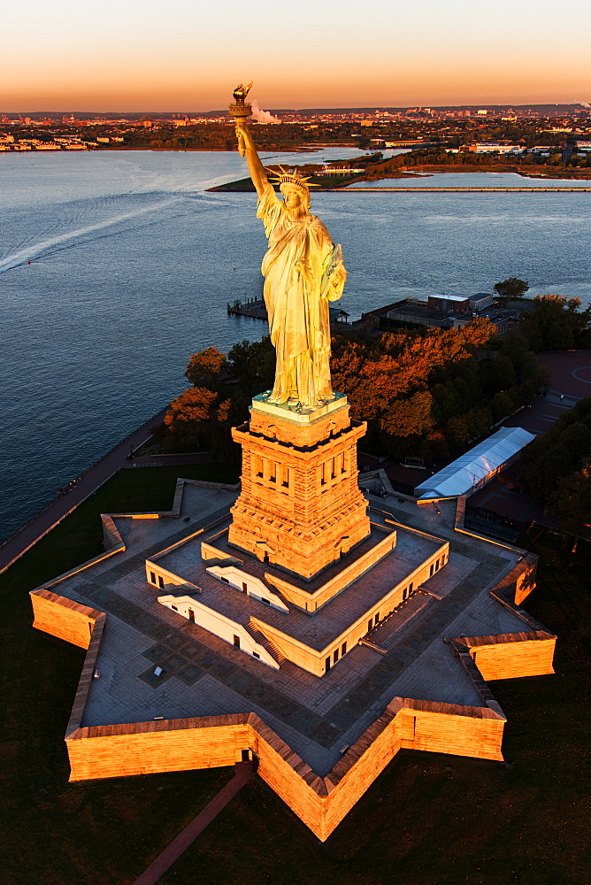 USA, New York State, New York City, Aerial view of Statue of Liberty at sunrise