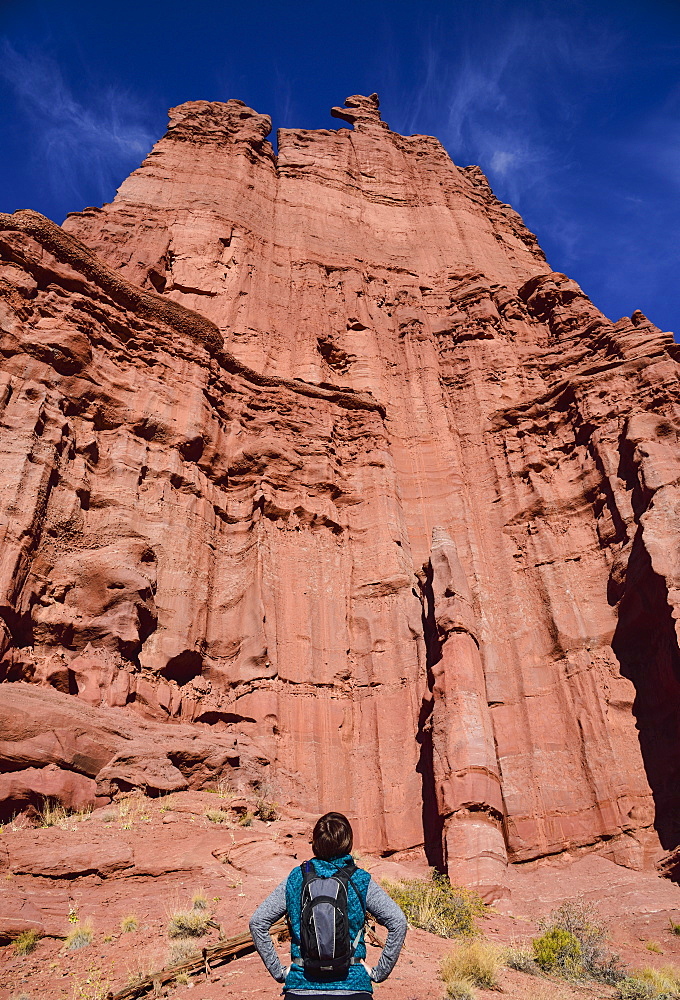 Woman standing by Fisher Towers in Utah, USA