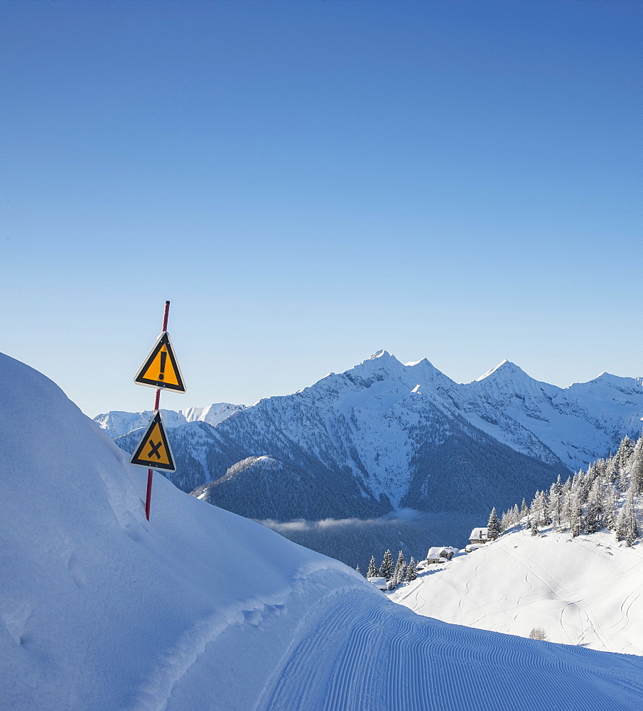 Warning signs on ski track in Piedmont, Italy