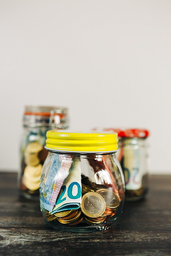 Euro currency in glass jars