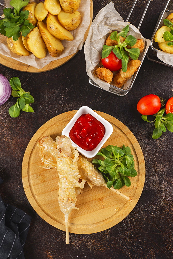 Deep fried food with tomato sauce