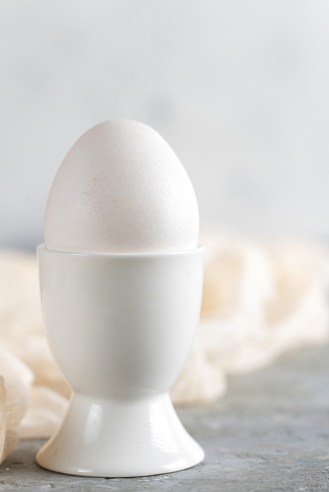 Boiled egg in egg cup