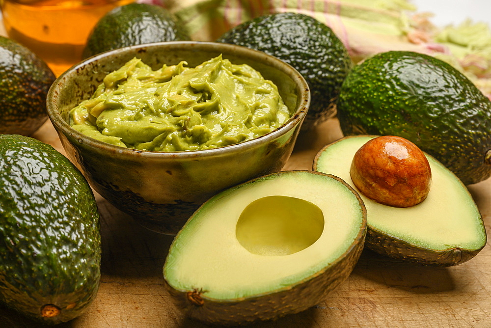 Bowl of guacamole with avocados