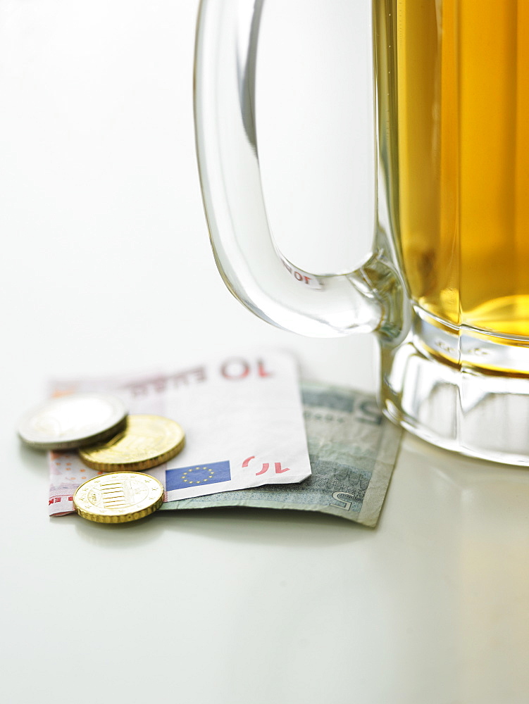 Beer mug and currency