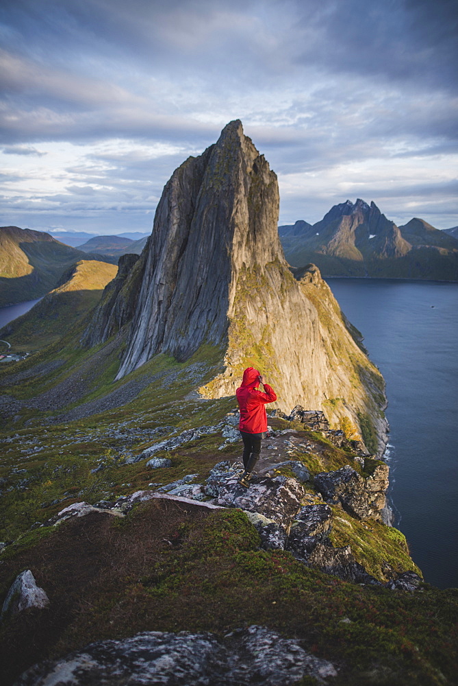 Norway, Senja, Man hiking near Segla mountain