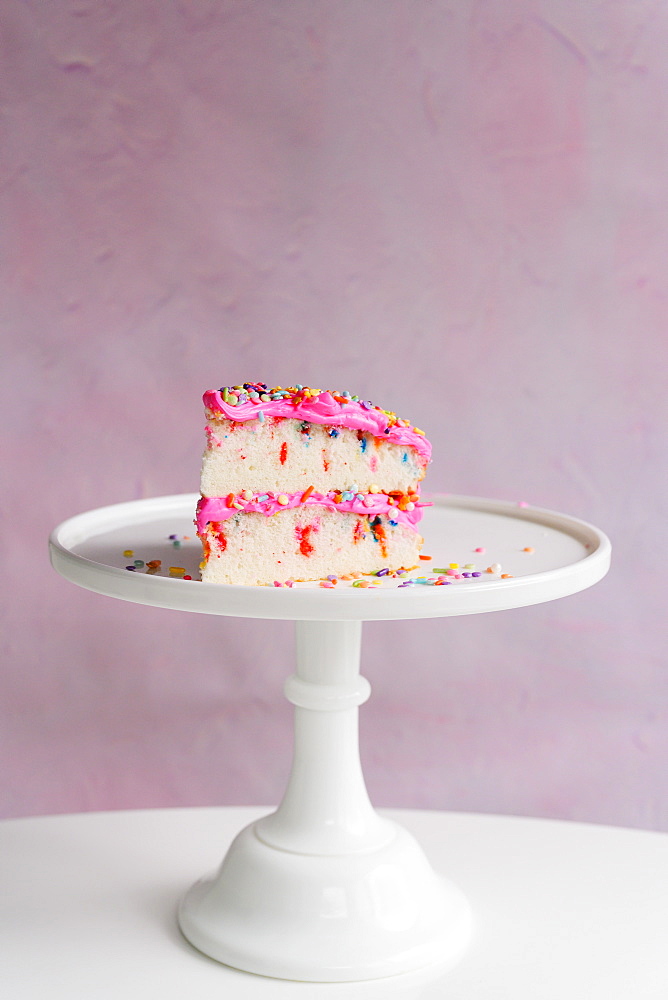 Slice of festive cake on cake stand