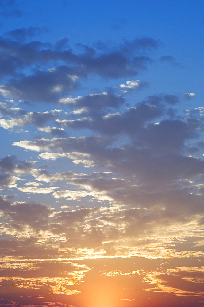 Sunset with puffy clouds