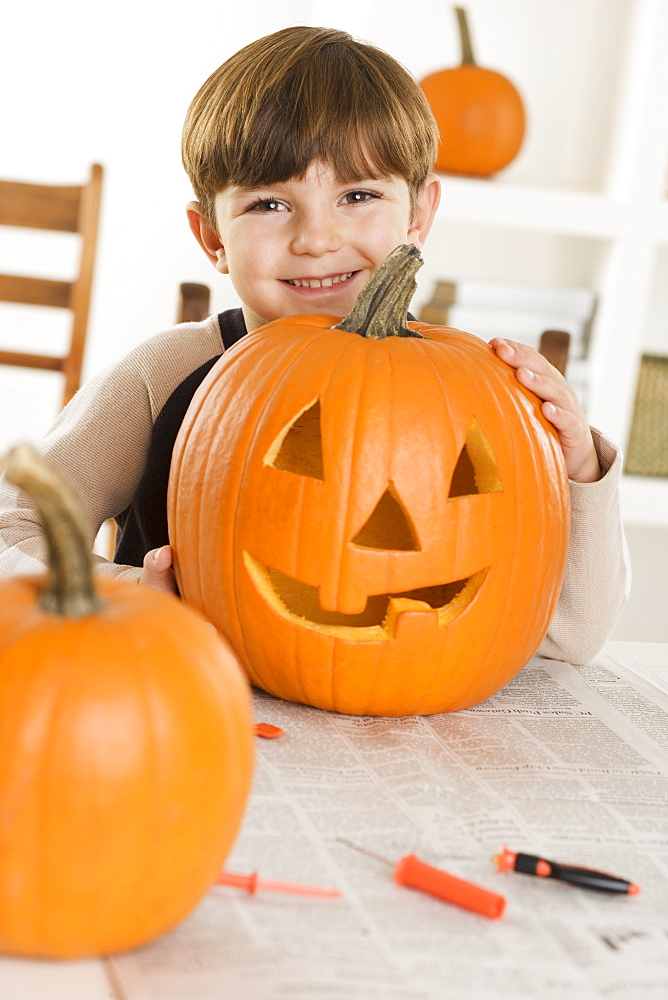 Young boy with a jack o lantern