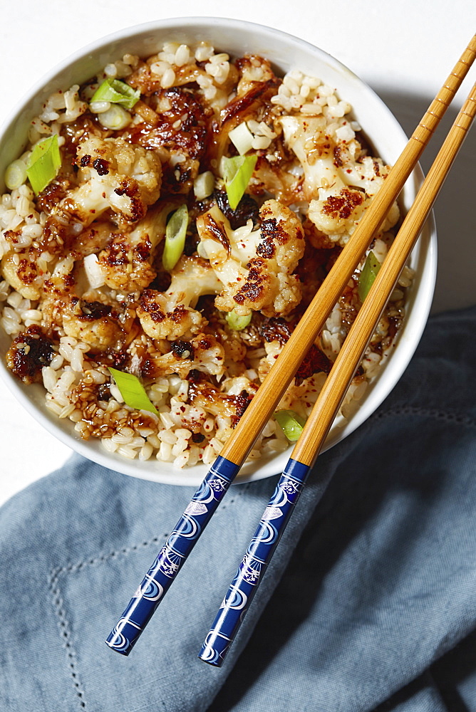 Vegetarian meal in bowl with chopsticks