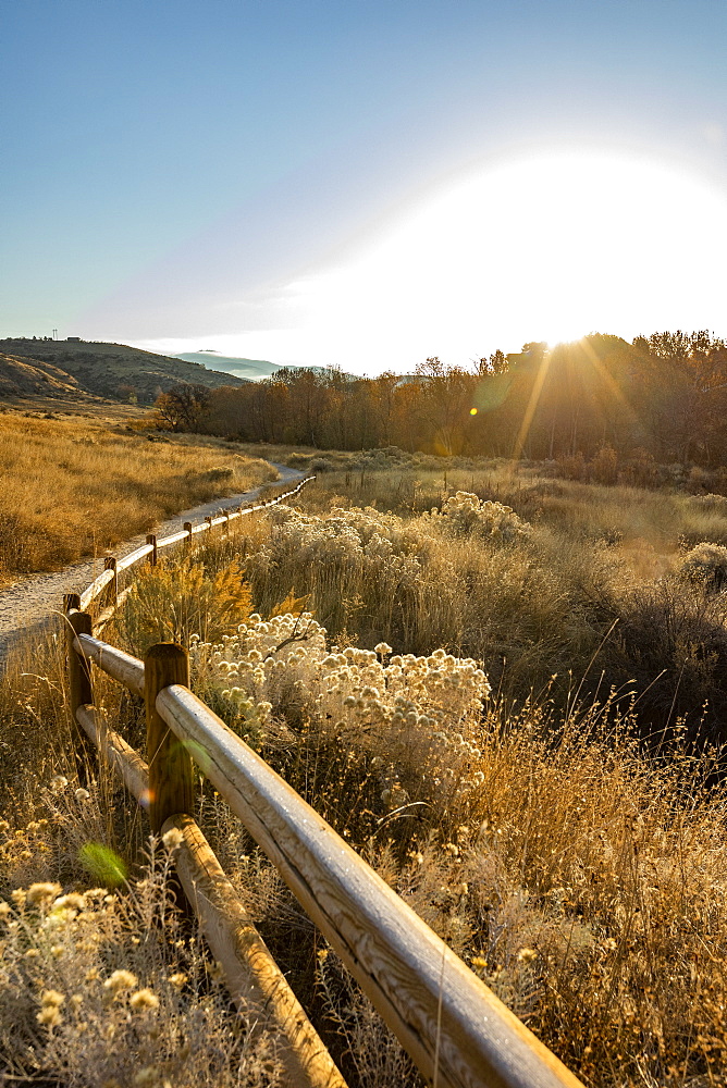 USA, Idaho, Boise, Path along fence in Military Reserve landscape