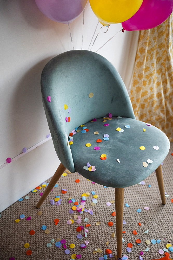 Confetti and balloons in room