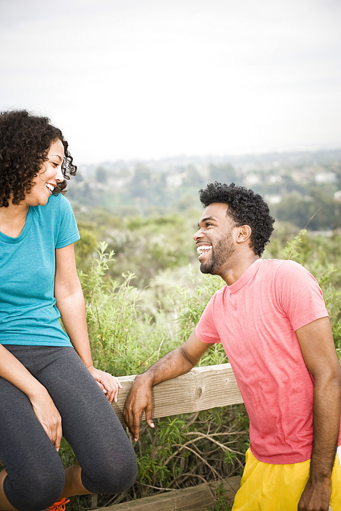 African American man laughing at girlfriend in remote area