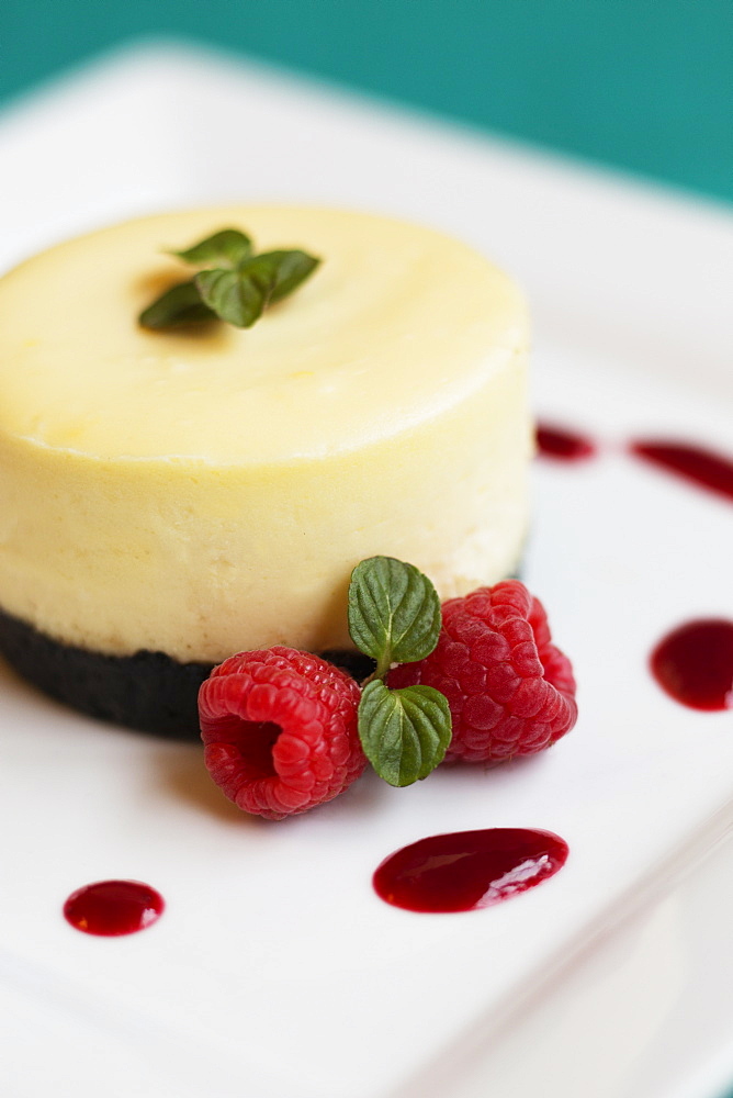 Raspberry cheesecake with fresh raspberries and mint