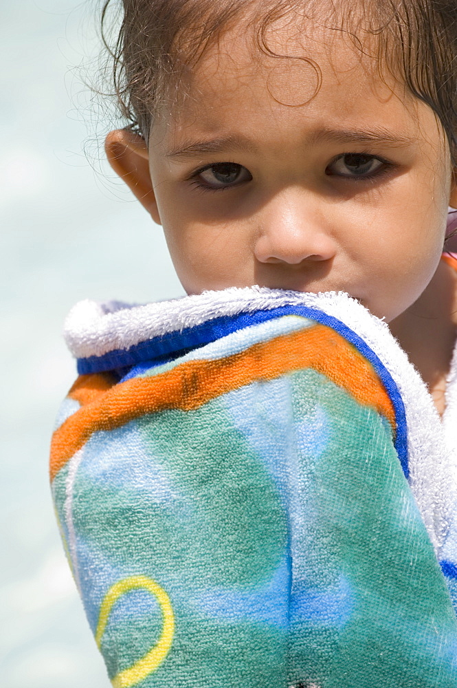 Closeup of child holding towel