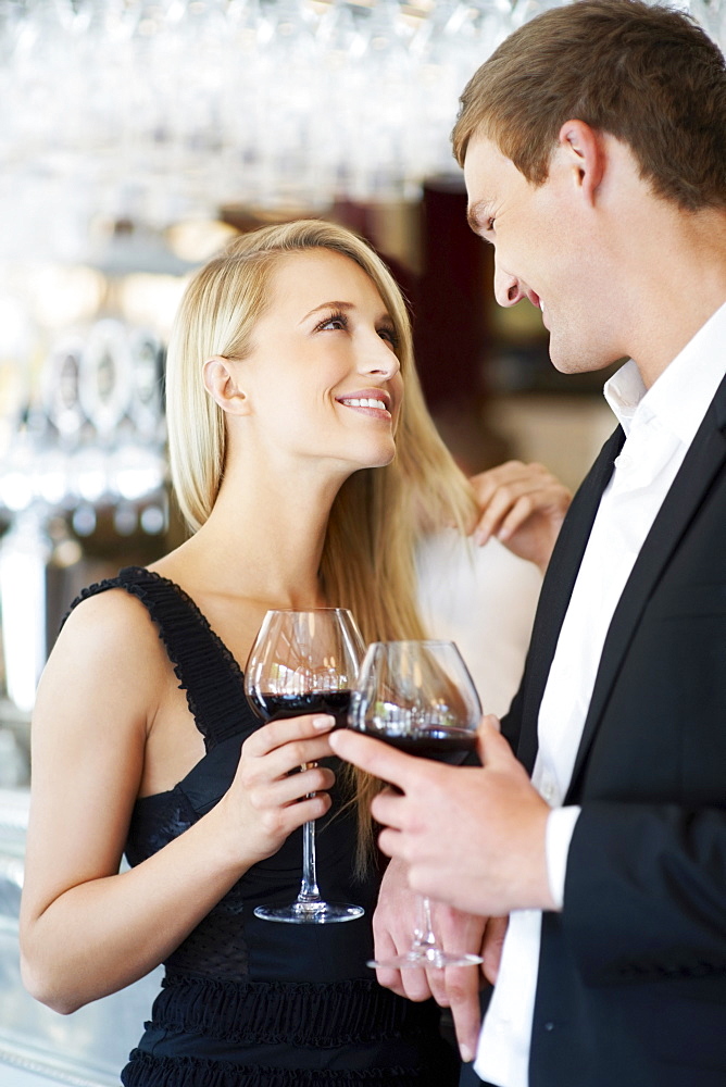 Couple drinking wine in restaurant