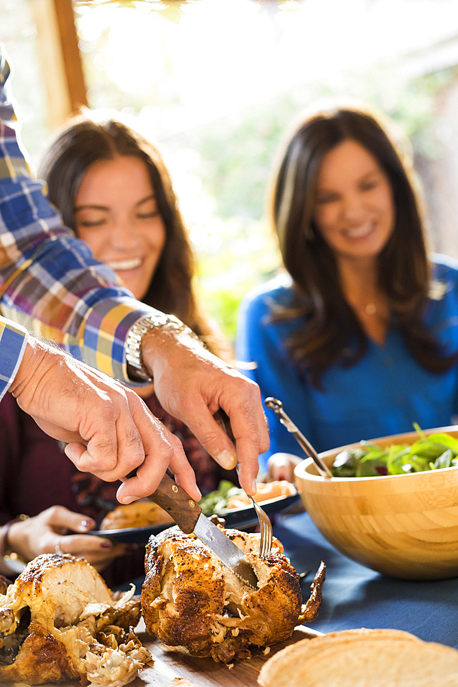 Family with daughter (10-11) eating dinner