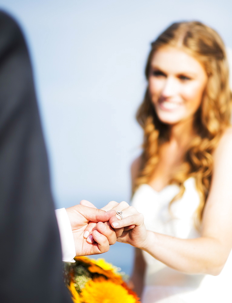 Bride and groom holding hands