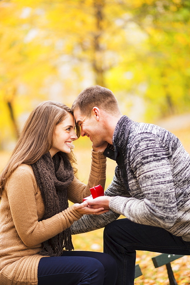 Young man proposing to young woman in Central Park, USA, New York State, New York City