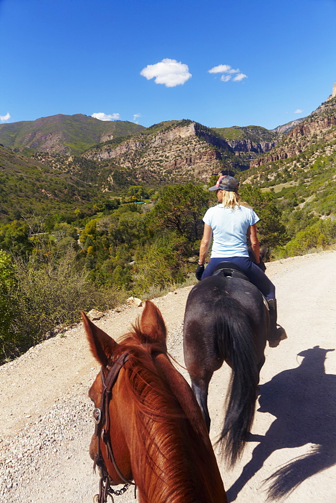 Woman riding horse, USA, Western USA, Colorado