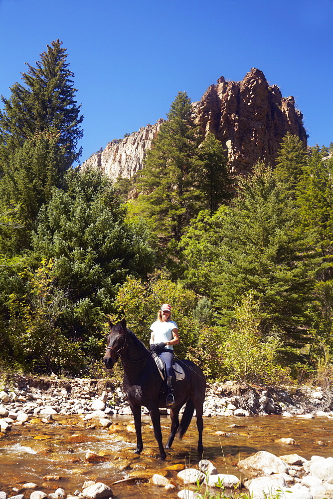 Woman riding horse, USA, Western USA, Colorado