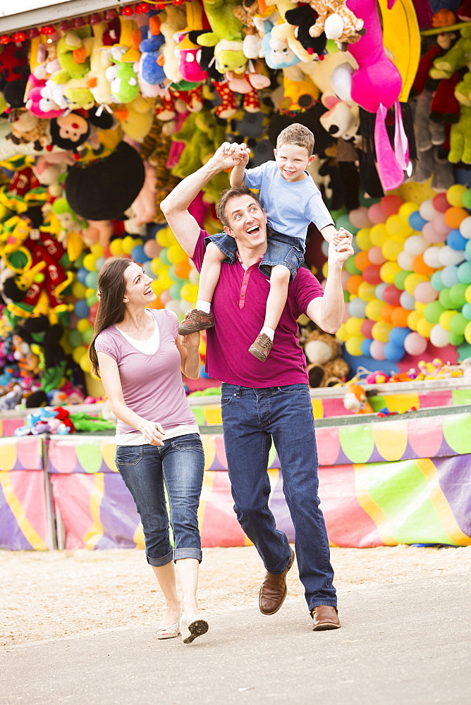 Happy Family with son (4-5) in amusement park, USA, Utah, Salt Lake City 