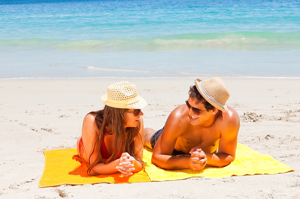 Couple being tanning while talking