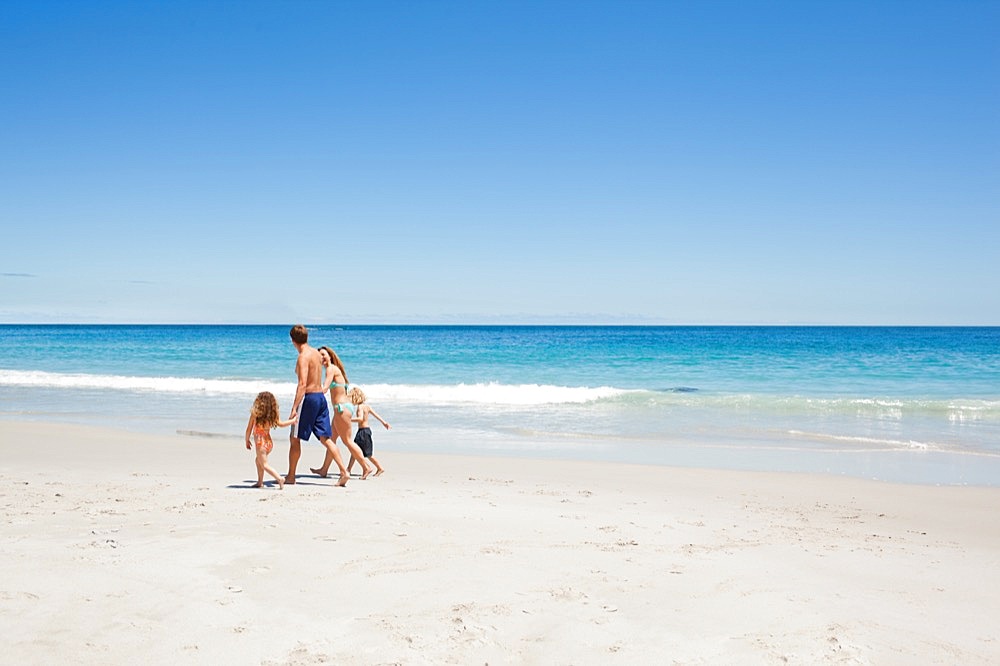 Family walking along the beach