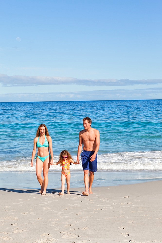 Family walking on the beach