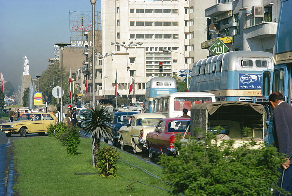 Street scene, pre-Revolution, with traffic in the city of Tehran, Iran, Middle East