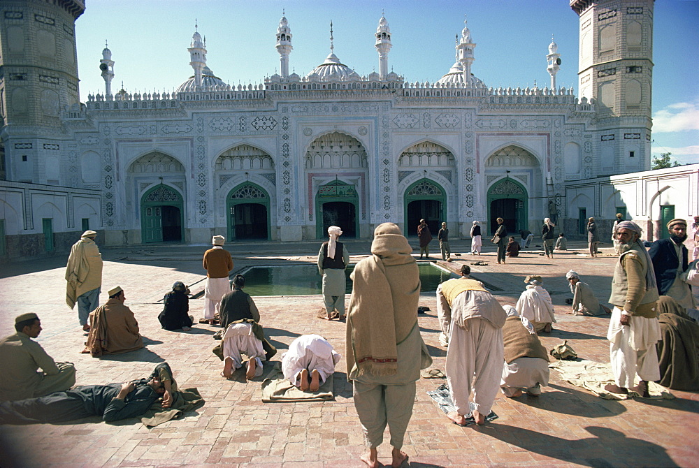 Groups of people praying outside the Mahabat Khan Mosque, Peshawar, Pakistan, Asia