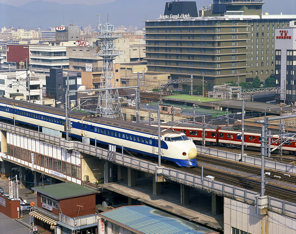 The bullet train passing the Grand Hotel in Kyoto, Japan, Asia