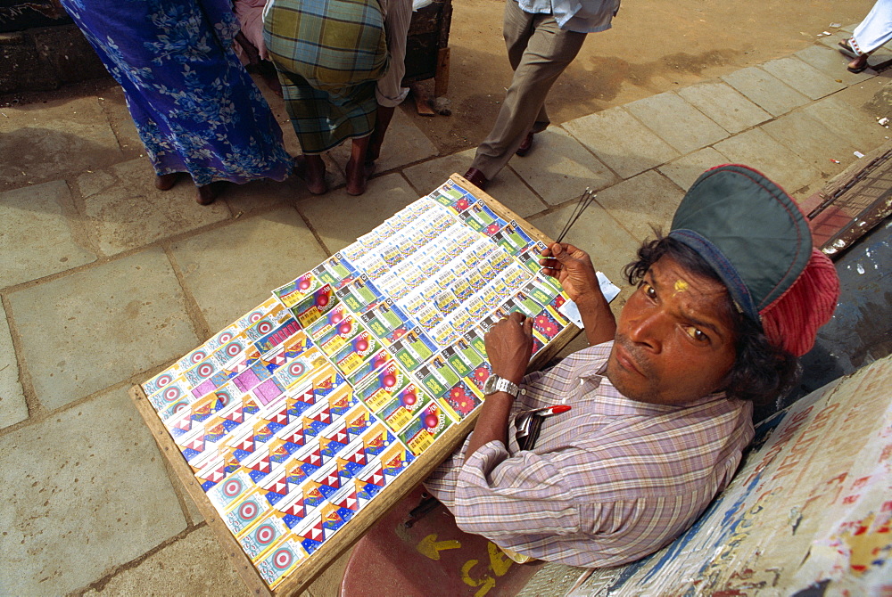 Man selling lottery tickets, Kandy, Sri Lanka, Asia