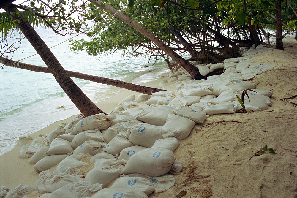 Plastic bags filled with sand as erosion control, Maldives, Indian Ocean, Asia