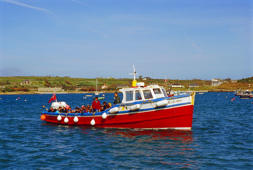 Tourists on boat, Scilly Isles, UK, Europe