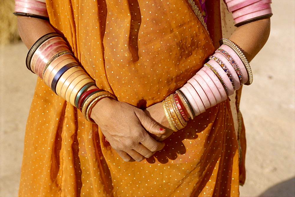 Bangles cover a woman's arms, Rajasthan state, India, Asia