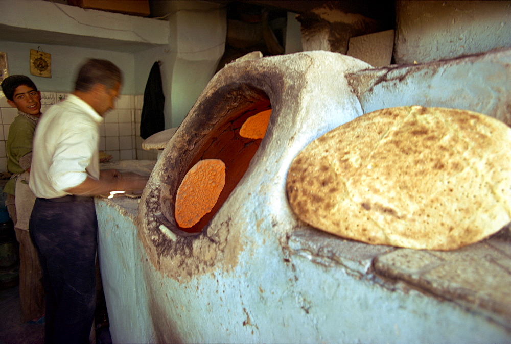 Man baking bread, Iran, Middle East