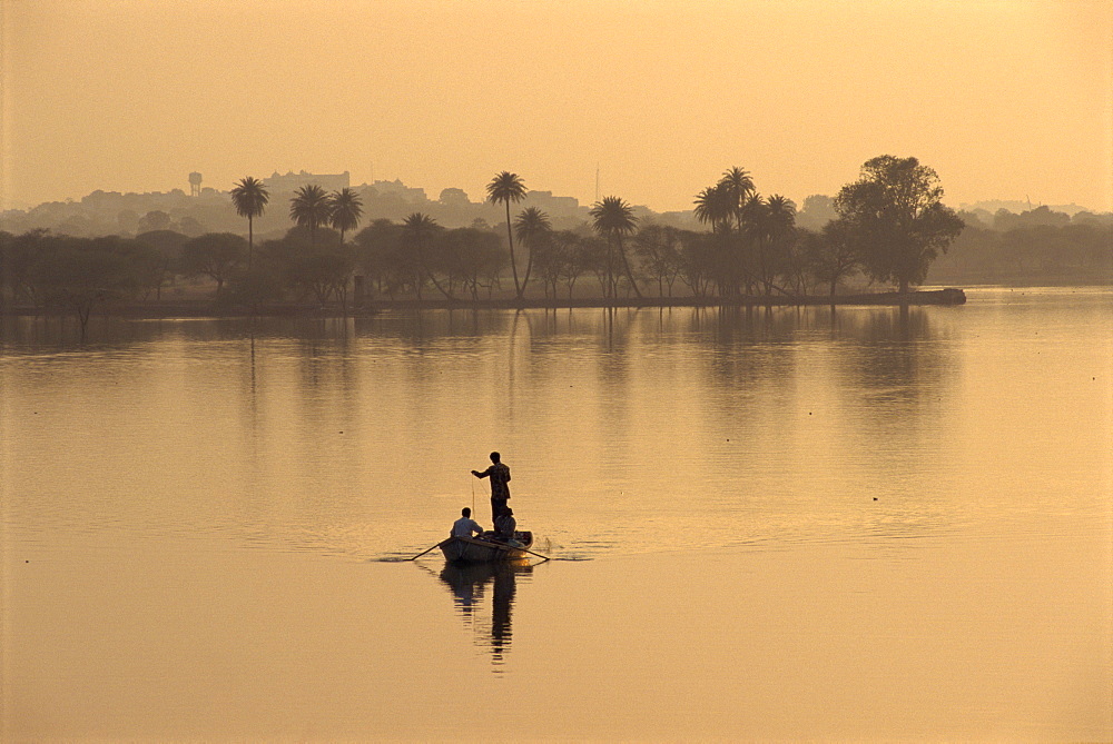 Men fishing in lake created by dam, Deogarh, Rajasthan state, India, Asia