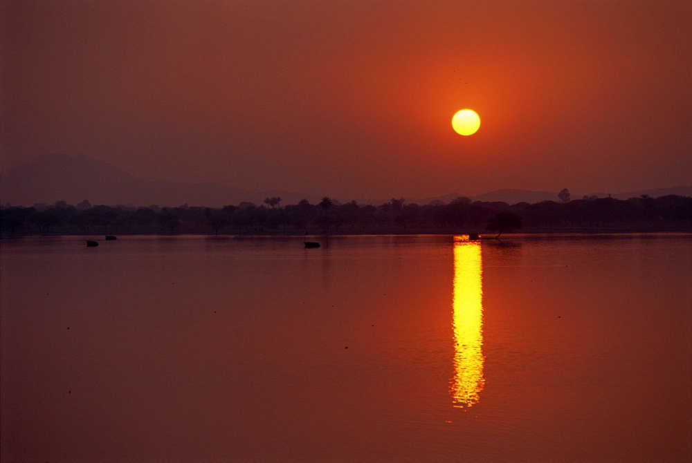 Sunset over lake created by dam, Deogarh, Rajasthan state, India, Asia